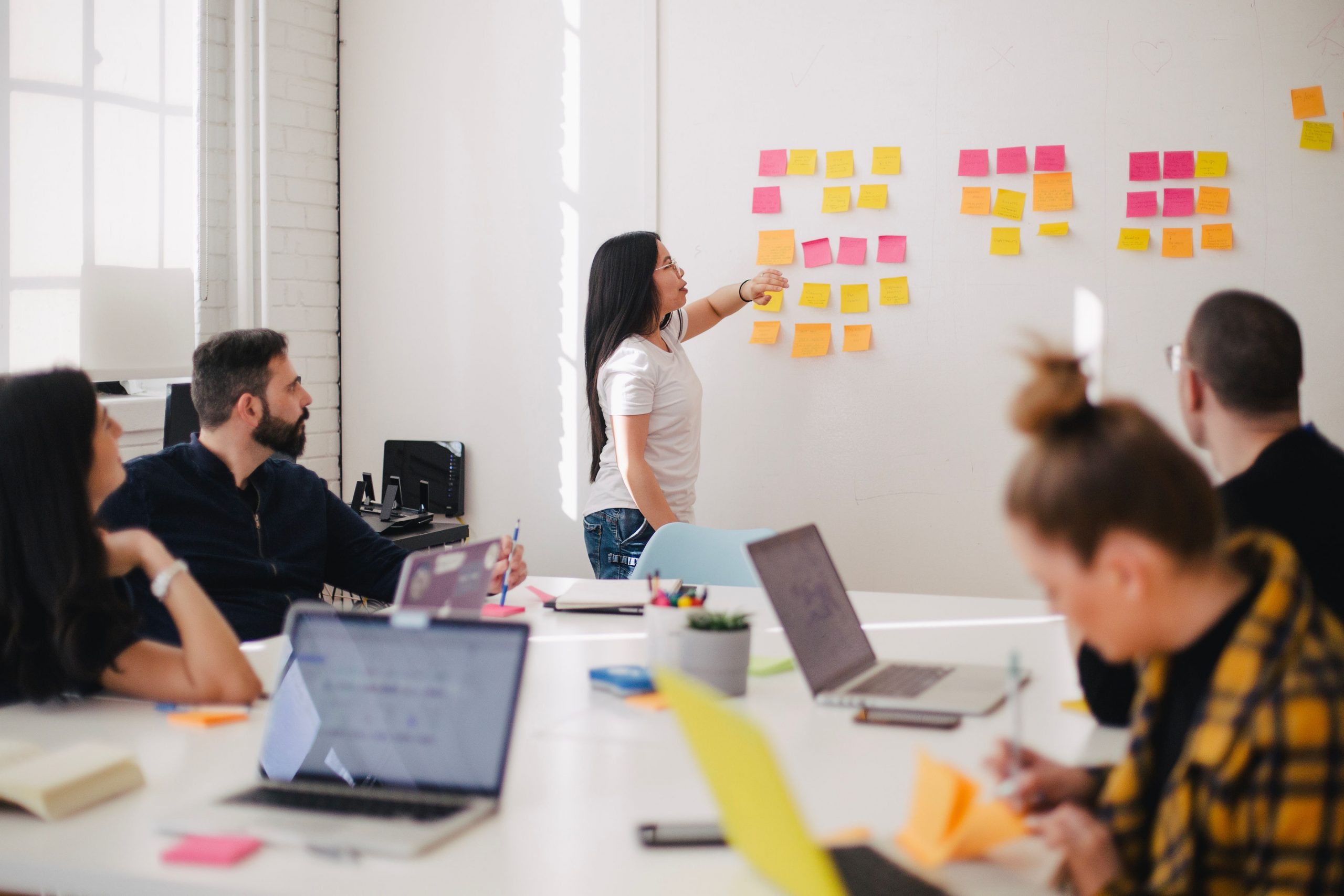Team collaborating in an office, representing Shopify merchant brands